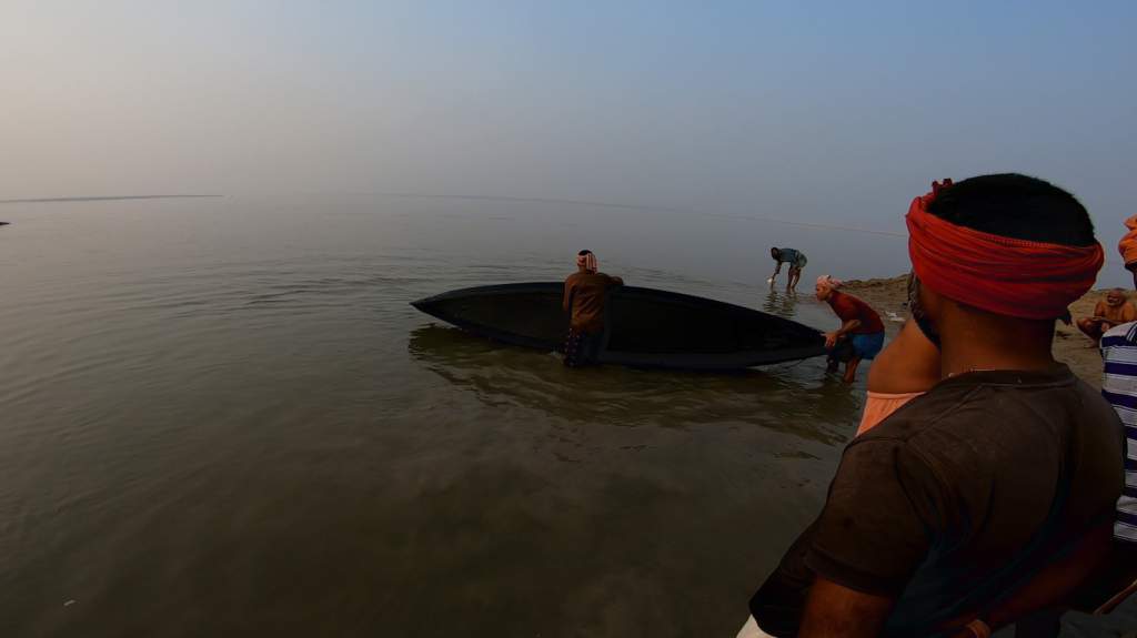 Helpful volunteers wash the boat